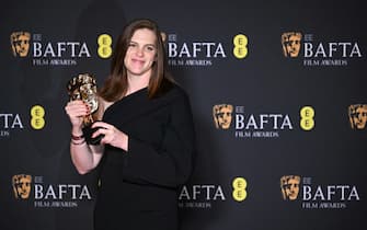 British film editor Jennifer Lame poses with the award for Best editing for "Oppenheimer" during the BAFTA British Academy Film Awards ceremony at the Royal Festival Hall, Southbank Centrer, in London, on February 18, 2024. (Photo by JUSTIN TALLIS / AFP)