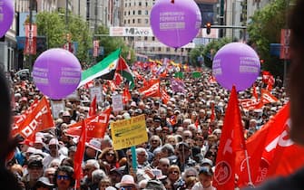epa11312237 Thousands of people participate in a demonstration under the motto 'For full employment: to reduce working hours and improving salaries' to mark International Labor Day 2024, in Madrid, central Spain, 01 May 2024.  EPA/FERNANDO ALVARADO