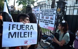 People take part in a demonstration against Argentina's President Javier Milei and in support of the national strike in Santiago, on January 24, 2024. Argentine President Javier Milei faced the first national strike in just 45 days of government, against his draconian fiscal adjustment and his plan to reform more than a thousand laws and regulations that governed for decades. The largest Argentine union called the strike in rejection, in particular, of the changes by decree to the labor regime promoted by Milei, which limit the right to strike and affect the financing of unions. (Photo by Pablo Vera / AFP) (Photo by PABLO VERA/AFP via Getty Images)