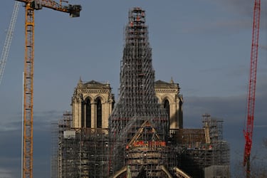 TOPSHOT - This photograph taken on November 29, 2023, shows a view of the scaffoldings around the wooden structure of the new spire in place at Notre-Dame de Paris Cathedral, on the Ile de la Cite in Paris, during reconstruction work. This spire is being reconstructed to be identical to the original one, destroyed in the fire of April 15, 2019 with the Cathedral set to be reopened at the end of 2024 according to the French Minsitry of Culture. (Photo by Miguel MEDINA / AFP) (Photo by MIGUEL MEDINA/AFP via Getty Images)