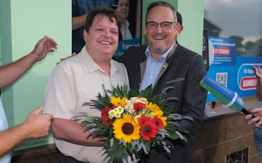 02 July 2023, Saxony-Anhalt, Raguhn-JeÃ nitz: Hannes Loth (M/ AfD) new mayor in Raguhn-JeÃ nitz, standing next to Martin Reichardt (r), state chairman of the AfD Saxony-Anhalt. In the small eastern German town of Raguhn-JeÃ nitz, the AfD will in future provide a full-time mayor for the first time in Saxony-Anhalt. In the runoff election on Sunday, AfD member of the state parliament Hannes Loth prevailed over the non-party candidate Naumann. Photo: Sebastian Willnow/dpa (Photo by Sebastian Willnow/picture alliance via Getty Images)