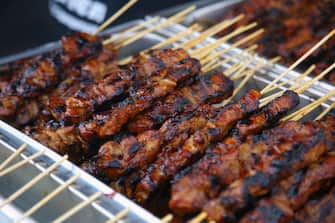 Chicken skewers at a food stall during the Taste of Manila Food Festival in Toronto, Ontario, Canada, on August 20, 2023. The festival took place in the area is also popularly known as Little Manila, and  is the largest Filipino food festival in Toronto. Authentic Filipino cuisine is the biggest highlight of the festival, offering thousands of attendees a chance to try lumpia, halo halo, lechon, pancit, and other traditional food delights. (Photo by Creative Touch Imaging Ltd./NurPhoto via Getty Images)