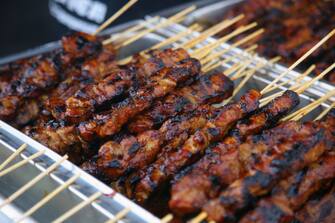 Chicken skewers at a food stall during the Taste of Manila Food Festival in Toronto, Ontario, Canada, on August 20, 2023. The festival took place in the area is also popularly known as Little Manila, and  is the largest Filipino food festival in Toronto. Authentic Filipino cuisine is the biggest highlight of the festival, offering thousands of attendees a chance to try lumpia, halo halo, lechon, pancit, and other traditional food delights. (Photo by Creative Touch Imaging Ltd./NurPhoto via Getty Images)