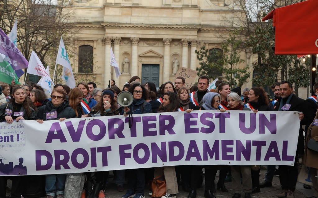 PARIS, FRANCE - FEBRUARY 28: People gather to stage a demonstration to support for legislative measures that uphold women's access to abortion in front of the Sorbonne Place in Paris, France on February 28, 2024. (Photo by Mohamad Salaheldin Abdelg Alsayed/Anadolu via Getty Images)