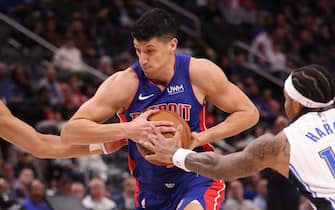 DETROIT, MICHIGAN - FEBRUARY 24: Simone Fontecchio #19 of the Detroit Pistons tries to drive between Jalen Suggs #4 and Gary Harris #14 of the Orlando Magic during the first half at Little Caesars Arena on February 24, 2024 in Detroit, Michigan. NOTE TO USER: User expressly acknowledges and agrees that, by downloading and or using this photograph, User is consenting to the terms and conditions of the Getty Images License.  (Photo by Gregory Shamus/Getty Images)