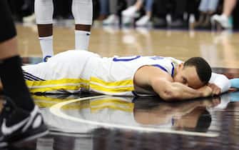 SACRAMENTO, CALIFORNIA - APRIL 30: Stephen Curry #30 of the Golden State Warriors reacts as he lies on the court during the third quarter against the Sacramento Kings in game seven of the Western Conference First Round Playoffs at Golden 1 Center on April 30, 2023 in Sacramento, California. NOTE TO USER: User expressly acknowledges and agrees that, by downloading and or using this photograph, User is consenting to the terms and conditions of the Getty Images License Agreement. (Photo by Ezra Shaw/Getty Images)