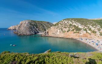 Overview of Cala Domestica beach with crystal clear water and Mediterranean vegetation, Sardinia, Italy, Europe. (Photo by: Fabiano Caddeo/REDA&CO/Universal Images Group via Getty Images)