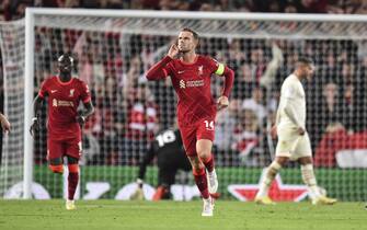epa09470601 Jordan Henderson (C) of Liverpool FC celebrates after scoring a goal during the UEFA Champions League group B soccer match between Liverpool FC and AC Milan in Liverpool, Britain, 15 September 2021.  EPA/Peter Powell