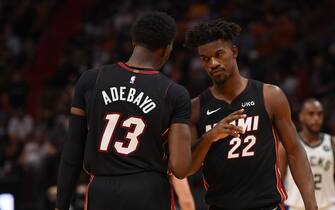 MIAMI, FL - MAY 29: Bam Adebayo #13 of the Miami Heat and Jimmy Butler #22 of the Miami Heat high-five during a game against the Milwaukee Bucks during Round One Game Four of the Eastern Conference Playoffs on May 29, 2021 at AmericanAirlines Arena in Miami, Florida. NOTE TO USER: User expressly acknowledges and agrees that, by downloading and/or using this Photograph, user is consenting to the terms and conditions of the Getty Images License Agreement. Mandatory Copyright Notice: Copyright 2021 NBAE (Photo by David Dow/NBAE via Getty Images)