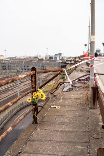 Flowers in the place where a bus with people on board fell from an elevated section ending up on the railway track that runs alongside the road, in Mestre, near Venice, Italy, 04 October 2023. Venice Prefect Michele Di Bari said Wednesday that the local council and the Veneto regional government were requesting the declaration of three days of mourning after 21 people died and 15 were injured on Tuesday when a bus plunged from an overpass in the Mestre district of the city.
Marco Albertini 2023