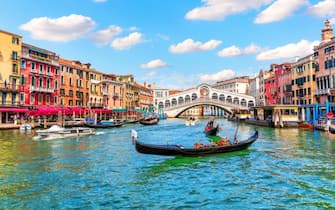 Gandolas near the Rialto Bridge in the Lagoon of Venice, Italy