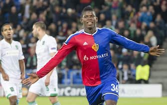 epa04476550 Basel's Breel Embolo, center, celebrates his first goal during an UEFA Champions League group B matchday 4 soccer match between Switzerland's FC Basel 1893 and Bulgaria's PFC Ludogorets Razgrad in the St. Jakob-Park stadium in Basel, Switzerland, on Tuesday, November 4, 2014.  EPA/PATRICK STRAUB