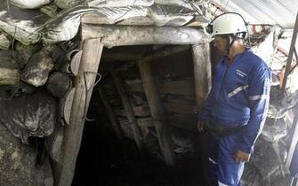 epa04471466 Authorities during the rescue works at the coal mine in Amaga, in the region of Antioquia, Colombia, 31 October 2014.Twelve workers died after being trapped due to  flooding following an explosion on, 30 October inside a coal mine which was operating legally. According to the Colombian authorities the 12 workers are dead.  EPA/Luis Eduardo Noriega