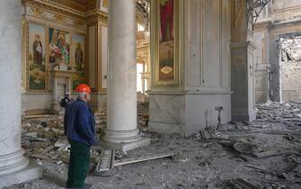 epa10763453 People clean debris near the Transfiguration Cathedral, damaged by a missile attack in the Odesa region, southern Ukraine, 23 July 2023. Odesa was attacked by 19 missiles of different classes early 23 July, with nine being shot down, according to a statement from the Ukraine Air Force. At least one person was killed in the attack and 22 were injured, including four children, the State Emergency Service reported. Russia, which began its full-scale invasion of Ukraine in February 2022, has recently pulled out of a UN-Turkey brokered agreement guaranteeing safe passage to Ukrainian grain exports through the Black Sea and started the mass shelling of Odesa city, granaries, agricultural enterprises and sea ports.  EPA/IGOR TKACHENKO