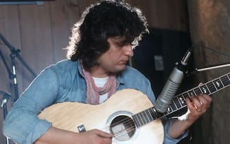 Italian singer-songwriter and musician Pino Daniele (Giuseppe Daniele) playing guitar. 1982. (Photo by Angelo Deligio/Mondadori via Getty Images)