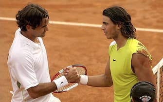 ROME - MAY 14:  Rafael Nadal of Spain shakes hands with Roger Federer of Switzerland, at the net, after defeating him in the final of the ATP Masters Series on May 14, 2006 at the Foro Italico in Rome, Italy.  (Photo by Clive Brunskill/Getty Images)