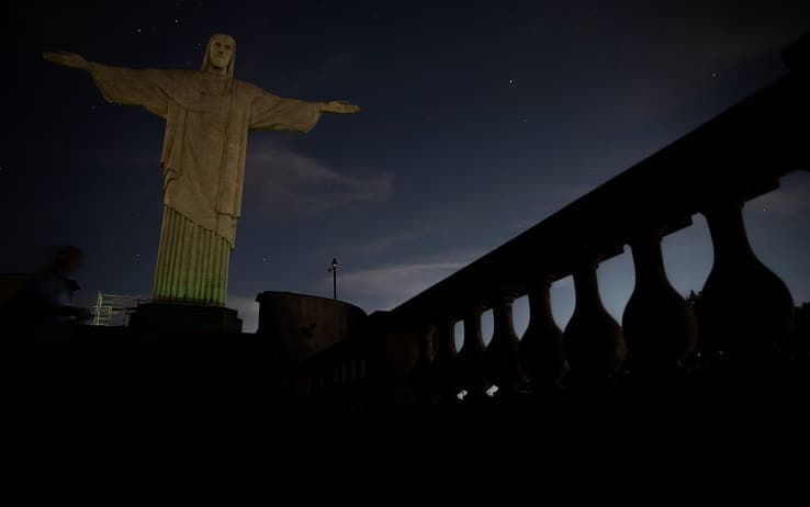 The Christ the Redeemer statue is seen without illumination to condemn racist acts against Brazilian footballer Vinicius Junior in Rio de Janeiro, Brazil, on May 22, 2023. The world-famous landmark had its illumination turned off for one hour in solidarity with Real Madrid's player Vinicius Junior, who was the target of persistent racist abuse during his team's 1-0 defeat to Valencia at the Mestalla Stadium in Spain's La Liga on May 21, 2023. The act was described "as a symbol of the collective struggle against racism and in solidarity with the player and all those who suffer prejudice around the world." (Photo by CARLOS FABAL / AFP) (Photo by CARLOS FABAL/AFP via Getty Images)