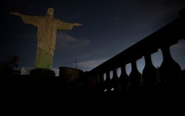 The Christ the Redeemer statue is seen without illumination to condemn racist acts against Brazilian footballer Vinicius Junior in Rio de Janeiro, Brazil, on May 22, 2023. The world-famous landmark had its illumination turned off for one hour in solidarity with Real Madrid's player Vinicius Junior, who was the target of persistent racist abuse during his team's 1-0 defeat to Valencia at the Mestalla Stadium in Spain's La Liga on May 21, 2023. The act was described "as a symbol of the collective struggle against racism and in solidarity with the player and all those who suffer prejudice around the world." (Photo by CARLOS FABAL / AFP) (Photo by CARLOS FABAL/AFP via Getty Images)