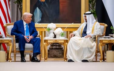 epa12104048 A handout photo made available by the UAE's Presidential Court shows Sheikh Mohamed bin Zayed Al Nahyan (R), President of the United Arab Emirates and Ruler of emirate of Abu Dhabi, sitting during the official reception of US President Donald Trump (L) during his visit to Abu Dhabi, United Arab Emirates, 15 May 2025.  EPA/UAE PRESIDENTIAL COURT / HANDOUT  HANDOUT EDITORIAL USE ONLY/NO SALESHANDOUT EDITORIAL USE ONLY/NO SALES