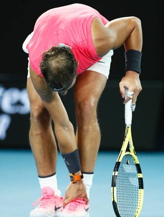 MELBOURNE, AUSTRALIA - JANUARY 23: Rafael Nadal of Spain reacts after hurting his foot during his Men's Singles second round match against Federico Delbonis of Argentina on day four of the 2020 Australian Open at Melbourne Park on January 23, 2020 in Melbourne, Australia. (Photo by Daniel Pockett/Getty Images)