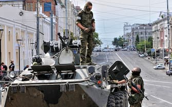 epaselect epa10709120 Servicemen from Private military company (PMC) Wagner Group block a street in downtown Rostov-on-Don, southern Russia, 24 June 2023. Security and armoured vehicles were deployed after private military company (PMC) Wagner Group s chief Yevgeny Prigozhin said in a video that his troops had occupied the building of the headquarters of the Southern Military District, demanding a meeting with Russia s defense chiefs.  EPA/ARKADY BUDNITSKY