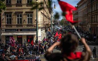 epa10601996 Protesters of the Anarchist Federation attend a rally on International Labor Day in Prague, Czech Republic, 01 May 2023. Participants took part in the May Day march protest against high prices amplified by the right-wing government, against the ongoing climate crisis, war and hatred of immigrants and LGBTQ+ people. Labor Day or May Day is observed all over the world on the first day of May to celebrate the economic and social achievements of workers and fight for laborers rights.  EPA/MARTIN DIVISEK