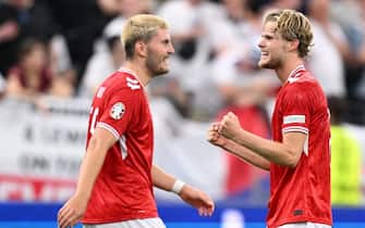 Denmark's midfielder #21 Morten Hjulmand (R) celebrates scoring his team's first goal during the UEFA Euro 2024 Group C football match between Denmark and England at the Frankfurt Arena in Frankfurt am Main on June 20, 2024. (Photo by Kirill KUDRYAVTSEV / AFP)