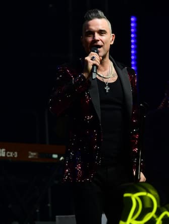 Robbie Williams surprises fans with a performance at the Hyde Park Winter Wonderland in Hyde Park, London, to celebrate the release of his first Christmas album 'The Christmas Present' which is out on Friday. (Photo by Ian West/PA Images via Getty Images)