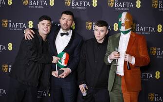 epa11901968 Members of Irish hip hop trio (L-R) Moglai Bap, Rich Peppiatt, and Mo Chara pose with DJ Provai in the press room during the BAFTA Film Awards at the Royal Festival Hall in London, Britain, 16 February 2025. The ceremony is hosted by the British Academy of Film and Television Arts (BAFTA).  EPA/TOLGA AKMEN