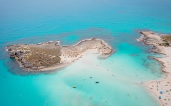 Aerial view of the most famous beaches in Cyprus - Nissi Beach. White sand beach with azure waters. Beautiful beach and panoramic views of Cyprus