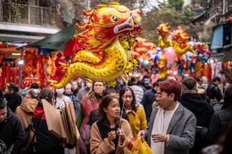 HANOI, VIETNAM - FEBRUARY 8: Dragon-shaped balloons are seen at the Spring Festival Fair in the Old Quarter on February 8, 2024 in Hanoi, Vietnam. Lunar New Year, also known as Chinese New Year, is celebrated around the world, and the year of the Wood Dragon in 2024 is associated with growth, progress, and abundance, as wood represents vitality and creativity, while the dragon symbolizes success, intelligence, and honor. (Photo by Linh Pham/Getty Images)