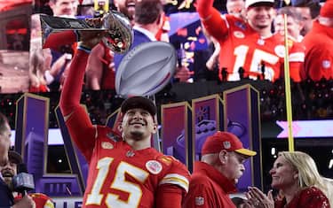 TOPSHOT - Kansas City Chiefs' quarterback #15 Patrick Mahomes celebrates with the trophy after the Chiefs won Super Bowl LVIII against the San Francisco 49ers at Allegiant Stadium in Las Vegas, Nevada, February 11, 2024. (Photo by TIMOTHY A. CLARY / AFP) (Photo by TIMOTHY A. CLARY/AFP via Getty Images)