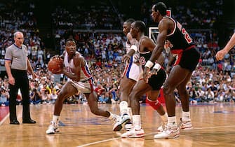 AUBURN HILLS, MI - 1990: Isiah Thomas #4 of the Detroit Pistons passes the ball during the 1990 NBA Finals circa 1990 at the Palace of Auburn Hills in Auburn Hills, Michigan. NOTE TO USER: User expressly acknowledges and agrees that, by downloading and or using this photograph, User is consenting to the terms and conditions of the Getty Images License Agreement. Mandatory Copyright Notice: Copyright 1990 NBAE (Photo by Andrew D. Bernstein/NBAE via Getty Images)