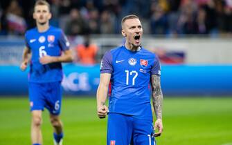 epa10979492 Lukas Haraslin (R) of Slovakia celebrates scoreing a goal during the UEFA EURO 2024 Group J qualification match between Slovakia and Iceland in Bratislava, Slovakia, 16 November 2023.  EPA/JAKUB GAVLAK