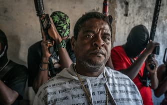 PORT-AU-PRINCE, HAITI - FEBRUARY 22:  Gang Leader Jimmy 'Barbecue' Cherizier with G-9 federation gang members in the Delmas 3 area on February 22, 2024 in Port-au-Prince, Haiti. There has a been fresh wave of violence in Port-au-Prince where, according to UN estimates, gangs control 80% of the city.  (Photo by Giles Clarke/Getty Images)