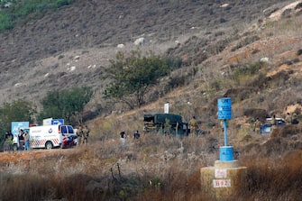 A picture taken from the northern Israeli town of Metula bordering Lebanon on October 7, 2023 shows Lebanese protesters and soldiers gathering on the Lebanese side of the border, after Hamas militants launched a deadly air, land and sea assault into Israel from the Gaza Strip. (Photo by JALAA MAREY / AFP) (Photo by JALAA MAREY/AFP via Getty Images)