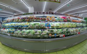 Fossano, Italy - September 10, 2022: Various seasonal salad packed and ready to eat in trasparent bag in the refrigerated counter in the Mercatò super