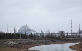 epa09879318 General view of the Chernobyl Nuclear power plant in Chernobyl, Ukraine, 08 April 2022. According to a statement on the situation in Ukraine by the International Atomic Energy Agency (IAEA) Director General on 31 March, Ukraine informed the IAEA that Russian forces that seized control of the Chernobyl Nuclear Power Plant (NPP) since 24 February 'had, in writing, transferred control of the NPP to Ukrainian personnel and moved two convoys of troops towards Belarus'. Russian troops entered Ukraine on 24 February resulting in fighting and destruction in the country and triggering a series of severe economic sanctions on Russia by Western countries.  EPA/MIKHAIL PALINCHAK