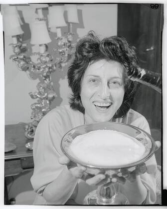 (Original Caption) Smiling actress Anna Magnani, a long time favorite of the Italian films, celebrates her victory after winning Hollywood's Academy Award for "Best Actress" of 1955 in her first American Film. The Fiery actress won the "Oscar" for her performance in The Rose Tattoo. (Photo by Â© Bettmann/CORBIS/Bettmann Archive)