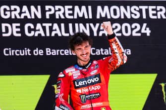 epa11371356 Italian rider Francisco Bagnaia celebrates on the podium after winning the MotoGP race of the MotoGP race of the Catalonian Grand Prix at the Circuit de Barcelona-Catalunya (also known as Montmelo racetrack), in Montmelo, Spain, 26 May 2024.  EPA/SIU WU