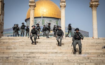 JERUSALEM - MAY 10:  Israeli police use tear gas, rubber bullets and stun grenades to disperse Palestinians who were on guard Al-Aqsa Mosque to prevent raids by extremist Jews, in East Jerusalem on May 10, 2021. (Photo by Eyad Tawil/Anadolu Agency via Getty Images)