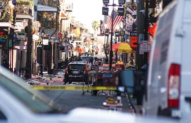 epa11801713 Police respond in the French Quarter after a car plowed into a crowd in New Orleans, Louisiana, USA, 01 January 2025. At least 10 people are dead and 30 injured after a man drove a white pickup truck into a crowd on Bourbon Street. The driver was killed in a shootout with police. The FBI is investigating the incident as an act of terrorism.  EPA/SHAWN FINK