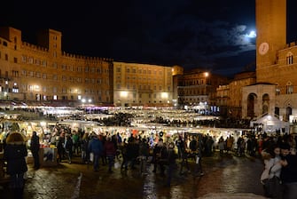 Opening of the traditional Christmas Market in Piazza del Campo in Siena (Photo by Andrea Lensini/Corbis via Getty Images)