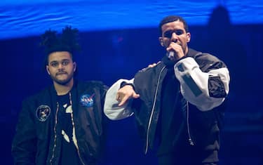 LONDON, UNITED KINGDOM - MARCH 24: The Weeknd and Drake performs on stage at O2 Arena on March 24, 2014 in London, United Kingdom. (Photo by Joseph Okpako/Redferns via Getty Images)