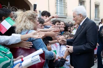 epa10662954 A handout picture made available by the Quirinal Presidential Palace (Palazzo del Quirinale) Press Office shows Italian President Sergio Mattarella (R) greeting citizens during his visit to areas of Emilia-Romagna region affected by the floods, in Modigliana (Forli-Cesena), northern Italy, 30 May 2023. Mattarella visited the northern Italian region of Emilia-Romagna after this month's devastating floods that claimed 15 lives and caused massive damage to agriculture.  EPA/FRANCESCO AMMENDOLA/QUIRINAL PALACE PRESS OFFICE HANDOUT  HANDOUT EDITORIAL USE ONLY/NO SALES