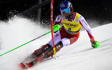 Marco Schwarz of Austria clears a gate during the first run of the Men's Slalom race at the FIS Alpine Skiing World Cup in Madonna di Campiglio, Italy, 22 December 2023.  ANSA/ANDREA SOLERO