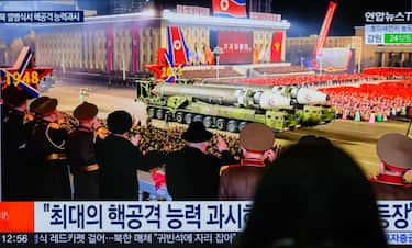 SEOUL, SOUTH KOREA - 2023/02/09: A person watches a television screen showing a news broadcast with an image of a North Korean military parade held in Pyongyang to mark the 75th founding anniversary of its armed forces, at Yongsan railway station in Seoul. North Korea has staged a massive military parade in Pyongyang to mark the 75th founding anniversary of its armed forces, its state media confirmed on February 9, describing intercontinental ballistic missiles (ICBMs) on display as representing the country's "maximum nuclear attack capabilities."
Its leader Kim Jong-un attended the nighttime event, held February 8, along with his wife, Ri Sol-ju, and apparent second child, Ju-ae, according to the North's official Korean Central News Agency (KCNA). (Photo by Kim Jae-Hwan/SOPA Images/LightRocket via Getty Images)