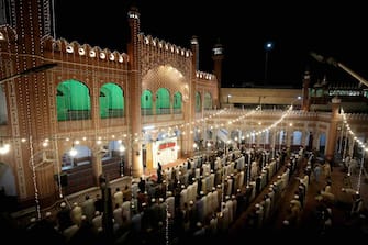 epa11262721 Muslims offer special Taravih prayers during the 27th night Laylat al-Qadr (Arabic for Night of Destiny) of Ramadan, the holy month of fasting, at Sunehri Mosque in Peshawar, Pakistan, 06 April 2024. Laylat al-Qadr is believed to be the night when the first verse of Islam's holy book, the Koran, was revealed to Prophet Muhammad, the exact date is not known but it is believed to be on an odd night of the last 10 nights of the holy month of Ramadan. The Muslims' holy month of Ramadan is the ninth month in the Islamic calendar and it is believed that the revelation of the first verse in the Koran was during its last 10 nights. It is celebrated yearly by praying during the night time and abstaining from eating, drinking, and sexual acts during the period between sunrise and sunset. It is also a time for socializing, mainly in the evening after breaking the fast and a shift of all activities to late in the day in most countries.  EPA/BILAWAL ARBAB