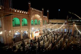 epa11262721 Muslims offer special Taravih prayers during the 27th night Laylat al-Qadr (Arabic for Night of Destiny) of Ramadan, the holy month of fasting, at Sunehri Mosque in Peshawar, Pakistan, 06 April 2024. Laylat al-Qadr is believed to be the night when the first verse of Islam's holy book, the Koran, was revealed to Prophet Muhammad, the exact date is not known but it is believed to be on an odd night of the last 10 nights of the holy month of Ramadan. The Muslims' holy month of Ramadan is the ninth month in the Islamic calendar and it is believed that the revelation of the first verse in the Koran was during its last 10 nights. It is celebrated yearly by praying during the night time and abstaining from eating, drinking, and sexual acts during the period between sunrise and sunset. It is also a time for socializing, mainly in the evening after breaking the fast and a shift of all activities to late in the day in most countries.  EPA/BILAWAL ARBAB