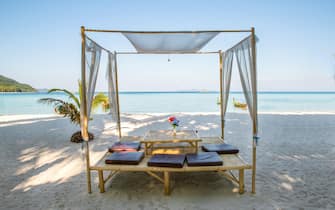 Romantic luxury dinner setting at tropical beach in Phuket, Thailand